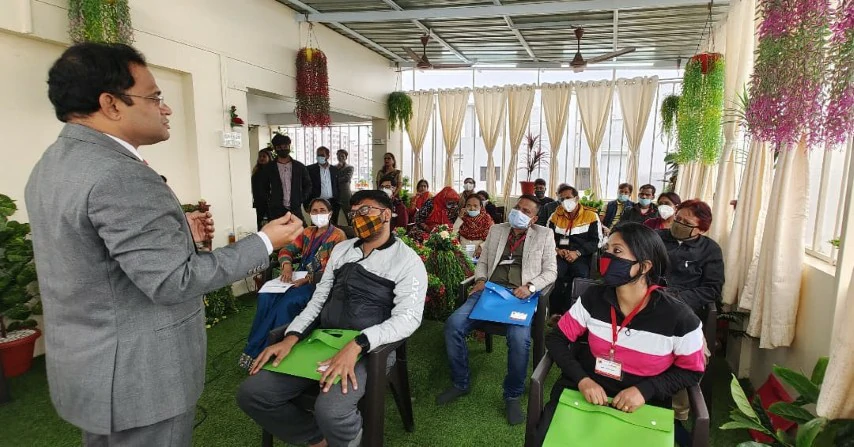 Dr. Ravi Vairagade addressing participants at a health seminar